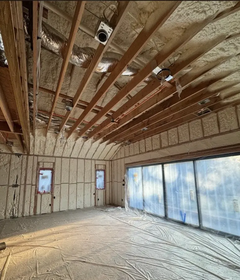 Interior walls and ceiling insulated with spray foam during new construction in Mill Creek East