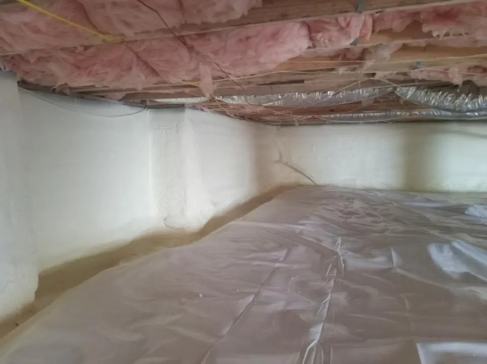 Crawl space encapsulation with closed-cell spray foam for Commercial Roof Restoration in Mill Creek East